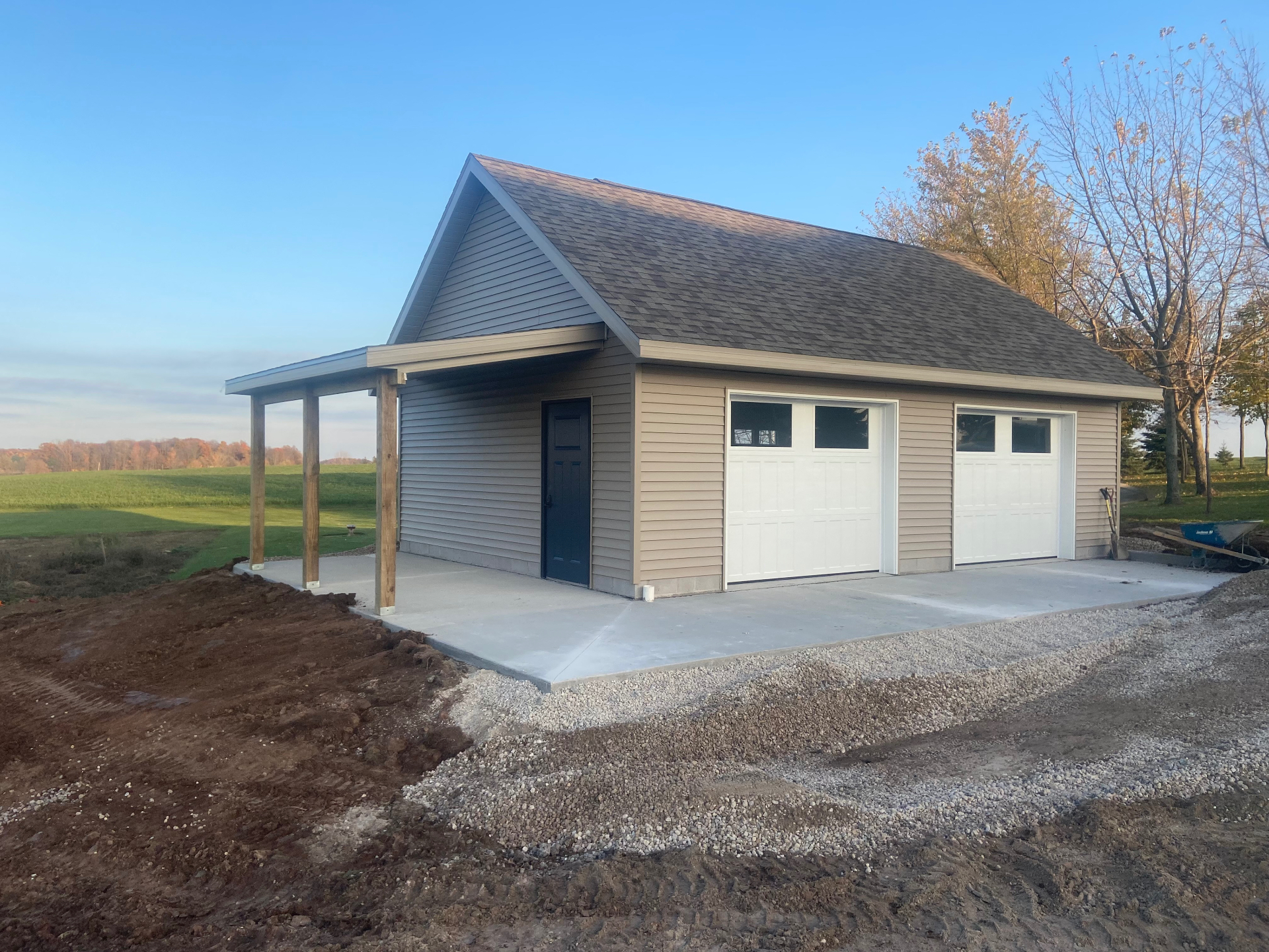 New-build two-car detached garage with covered side porch