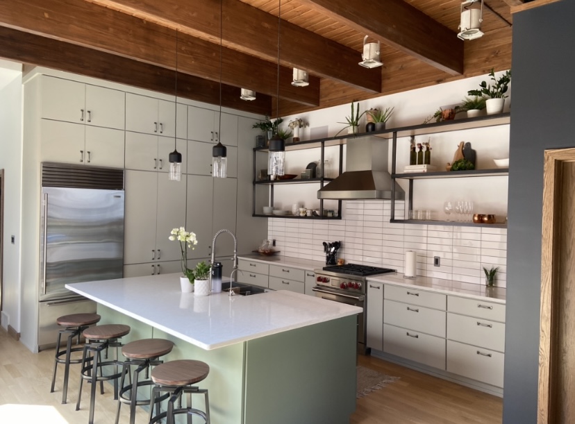 Remodeled white shaker kitchen with quartz island in a Plymouth WI home